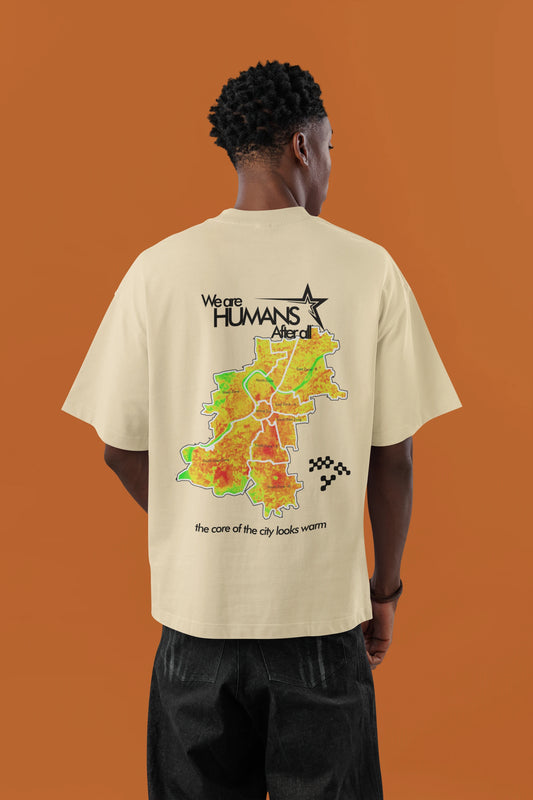 Model wearing cream oversized graphic t-shirt with Humans After All city artwork back print by Cluvian
