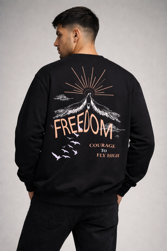 Man wearing black Freedom graphic sweatshirt with oversized back print streetwear design by Cluvian